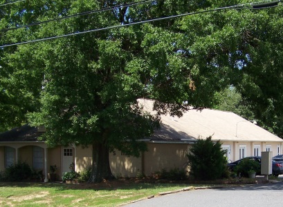 Our offices in Matthews, North Carolina. Picture taken in the summer, with the trees in full green