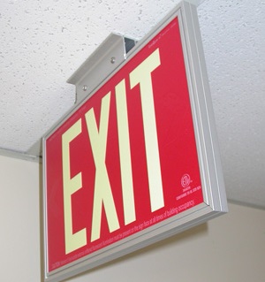 Red Single Sided Exit Sign with standard architectural framing system and mounting bracket for ceiling or wall installation